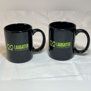 2 black ceramic mugs with phrase “laughter is the best medicine.” EUC